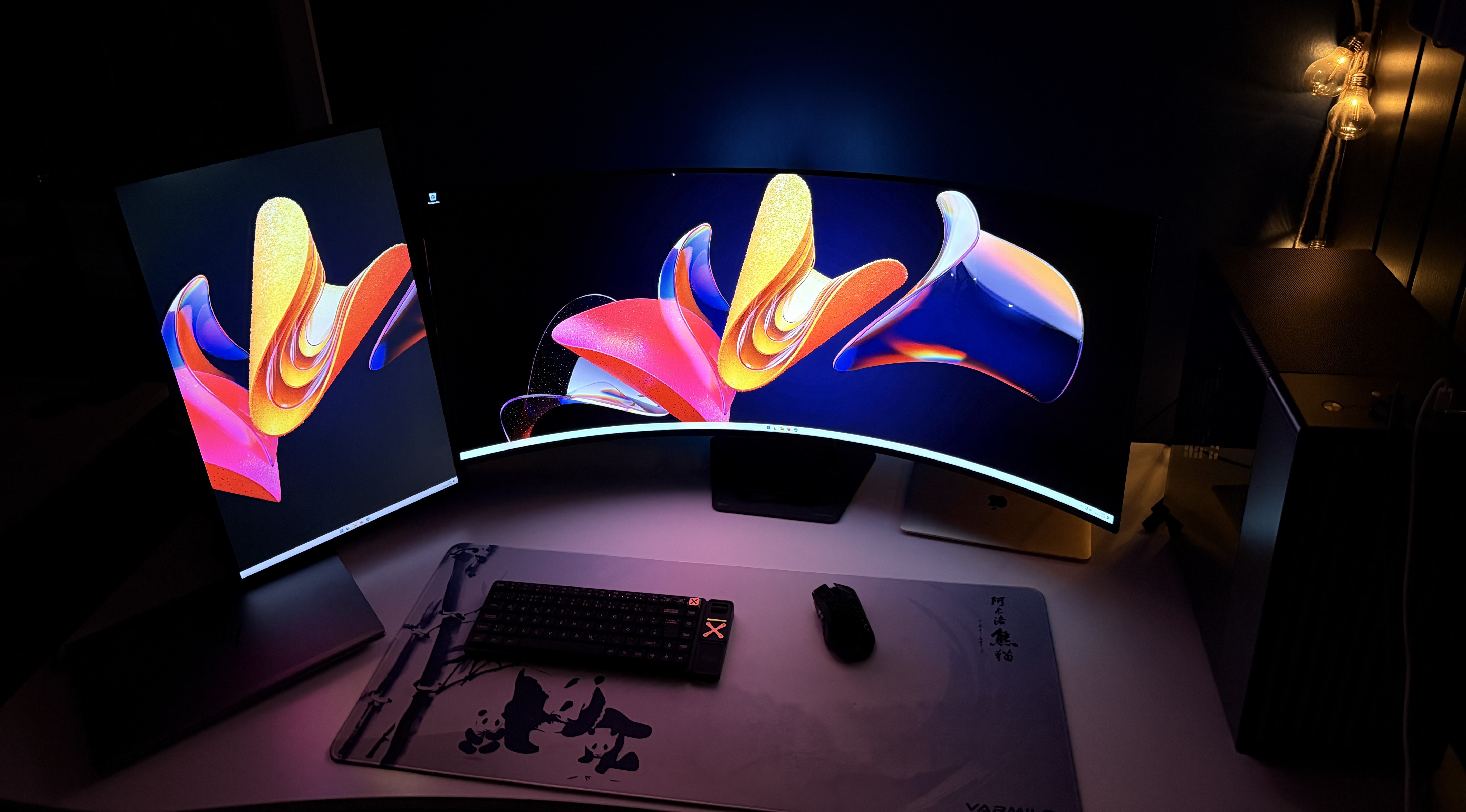 Operator workstation — ultrawide and portrait monitors, local AI infrastructure